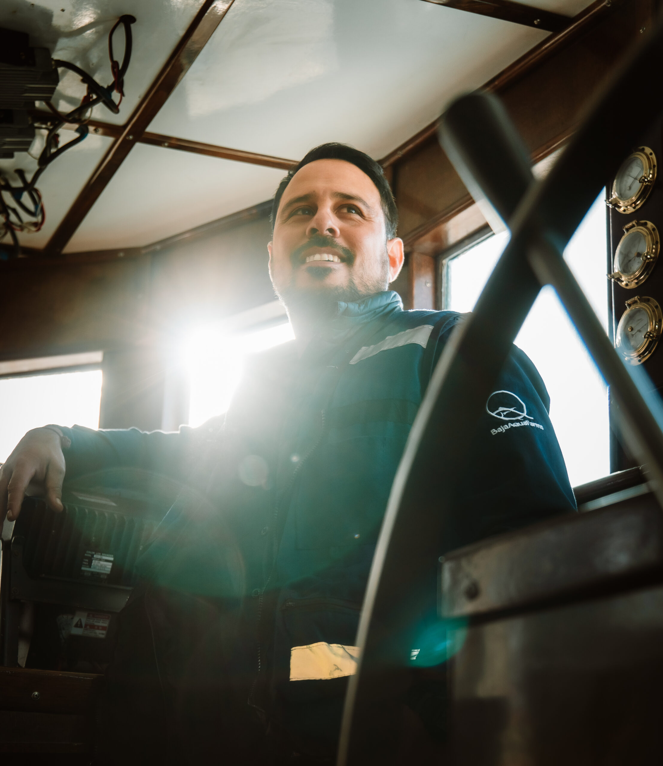 Crew member on a Baja Aqua-Farms vessel at sea.