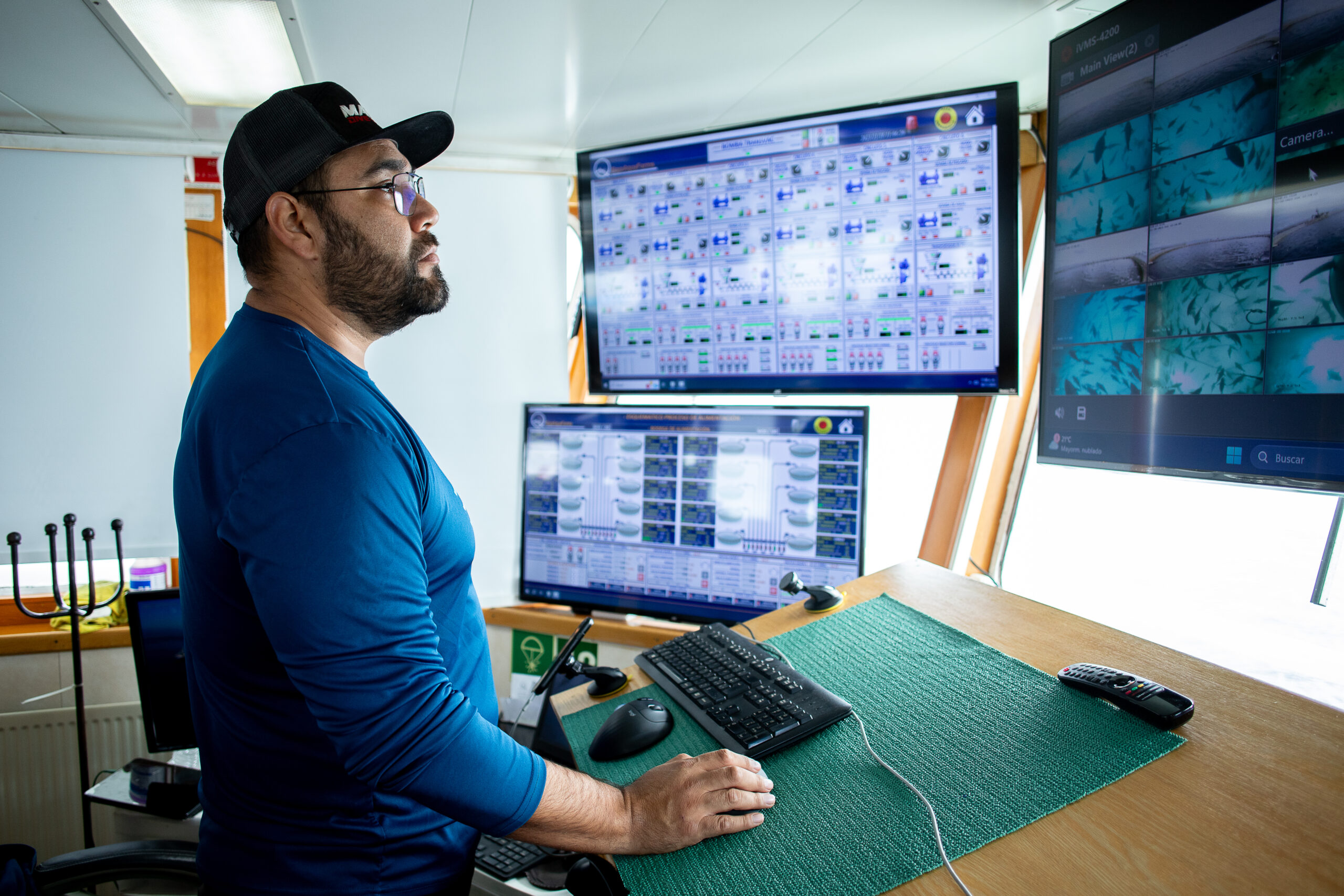 Technician at the Baja Aqua-Farms digital control and monitoring station.
